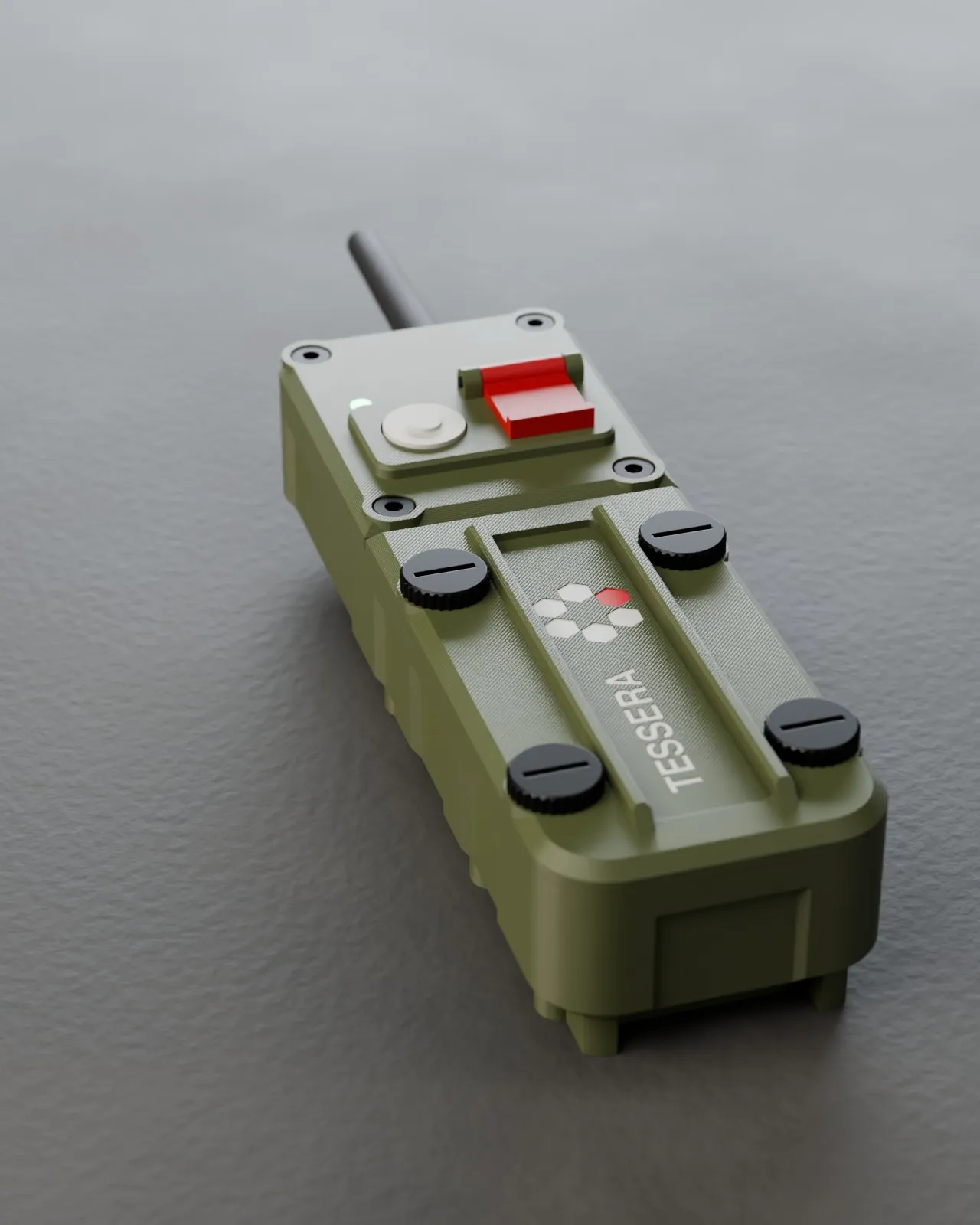 Rendering of the Tessera tracker in olive, lying on a dark surface